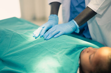 Fototapeta premium Doctor treating a kid patient in the operating room