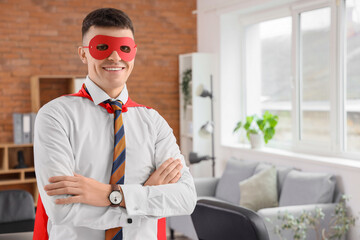 Businessman dressed as superhero in office
