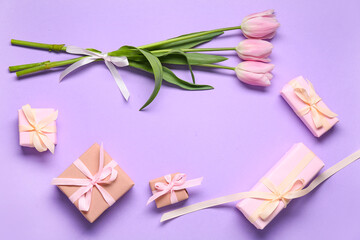 Frame made of gift boxes and pink tulips on lilac background. Top view