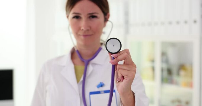 Doctor holds stethoscope examining and insuring