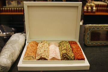Assortment of Turkish delight with various nuts at market