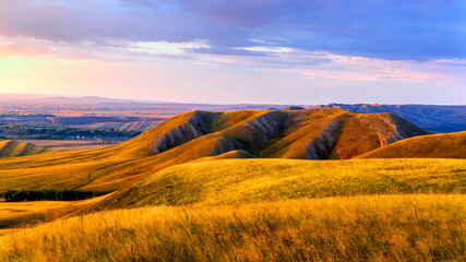 Magnificent landscape of the Karamuruntau ridge in the rays of the setting sun
