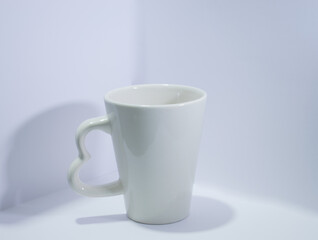white cup on a table