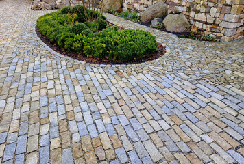 square with big of cobblestone cubes. the stone is granite and boulder.  court of honor where...