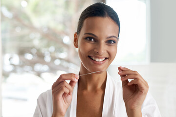 Happy woman, flossing and dental for teeth whitening, mirror or reflection in bathroom for morning...