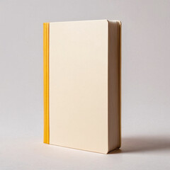 Minimalist hardcover book with a simple design and yellow spine, set against a neutral background.