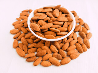 Almonds nuts in a bowl sweet almond nut  dry fruit food ingredient lauz  amendoa badem mandle  orechor amandel almendra badam closeup view image stock photo
