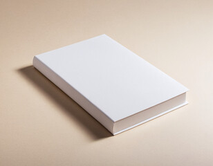 Plain white book with a minimalist cover on a beige background, highlighting its simplicity and potential for personalized design.