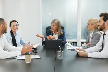 Lawyers working together at table in office