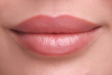 Obraz premium Woman with beautiful full lips as background, closeup