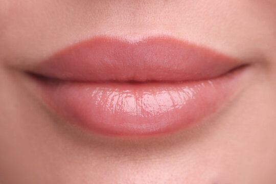 Woman with beautiful full lips as background, closeup