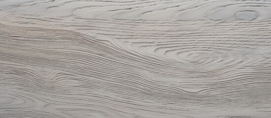 Detailed close-up view of a sand erable veneer wood grained surface, showcasing intricate patterns and textures in grey color for home design purposes.