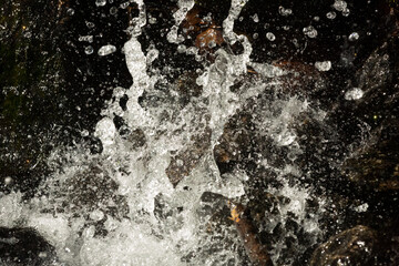 High shutter speed reveals patterns in a splashing waterfall.