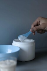 hand holding a spoon of massause lotion