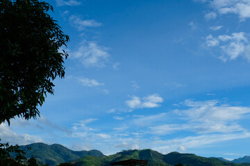 Background Photography. Blue sky landscape with abstract cloud texture. Clouds over the hills, aerial view, texture background, nature background. Photographed on the rooftop in the morning