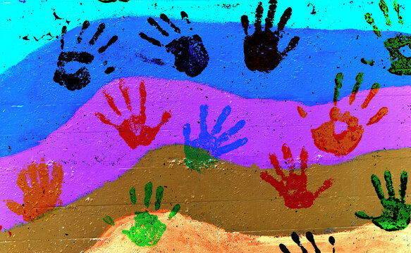 Colorful handprints on the rainbow flag