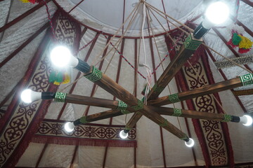 Modern lighting in the yurt. The national traditional Kazakh house. The dwelling of the nomads.