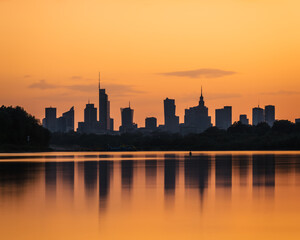 Warsaw, Poland - panorama of a city skyline at sunset. Cityscape view of Warsaw with reflection of skyscrapers