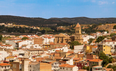Convento e iglesia conventual de Santa Clara en Loja. Vista del campanario y tejado rodeado de los edificios residenciales en Loja, Espa&ntilde;a.
