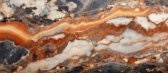 A detailed view of a marble surface featuring a blend of orange and white colors. The intricate patterns and smooth texture of the marble are highlighted in this close-up shot.