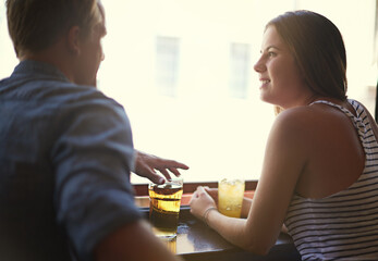 Talk, happy couple and drinking beer in pub, relax and leisure together in restaurant with alcohol....