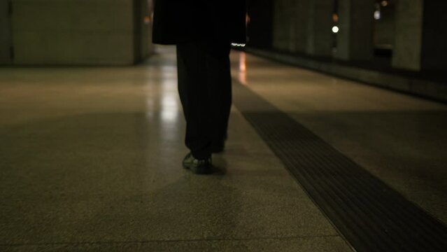 Man footsteps on train station
