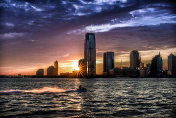 A Dreamlike Sunset over the Waters of Hudson River with Jersey City Skyline on the Horizon - Manhattan, New York City