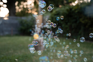 Bubbles Floating In The Air During Summertime Play