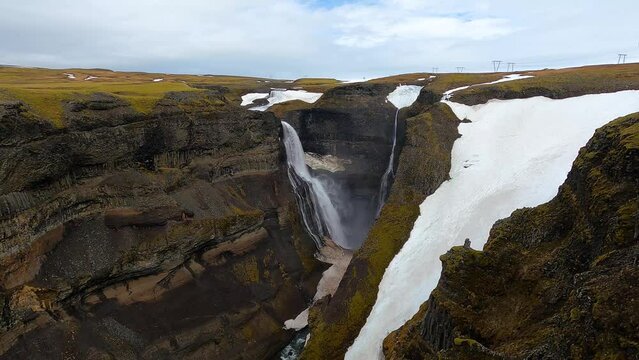 Haifoss waterfall and canyon landscape with snow in Iceland