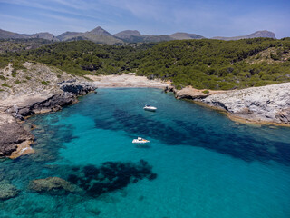 Fototapeta na wymiar pleasure boats at anchor , protected natural area, capdepera, Mallorca, Balearic Islands, Spain