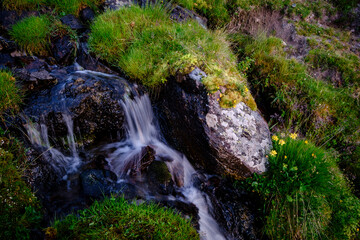 small waterfall front Midi d Ossau,  Gentau lake, Ayous lakes tour, Pyrenees National Park,...