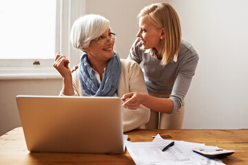 Granddaughter, grandmother and helping with laptop for online payment, finance and technology with...