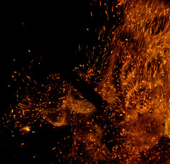 fire flame with sparks on black background.