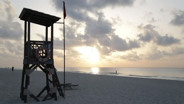 Beach Lifeguard Chair on the beach at sunrise