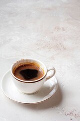 Fototapeta na wymiar A simple, elegant coffee cup filled with black coffee, against a blank background, emphasizing minimalism and serenity