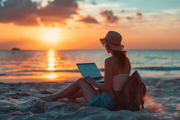 Young woman doing Beach Remote Working at Dusk, Embracing the Digital Nomad Lifestyle. Business with laptop while travelling and enjoying freedom.