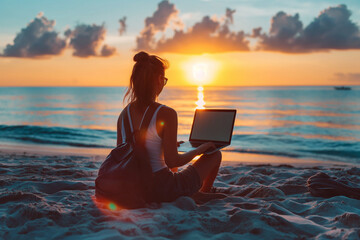 Serene Sunset Work Session on Tropical Beach. Young woman at the sea with her laptop. Concept of Digital nomad, remote work, freelance and freedom