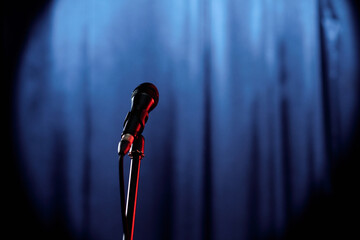 Microphone prepared for comedian of stand up club or participant of popular evening show standing...