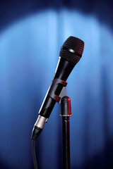 Microphone of participant of evening show or actor having rehearsal standing in front of camera on...