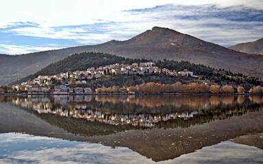 Kastoria town reflected on the waters of Orestiada lake, Western Macedonia, Greece