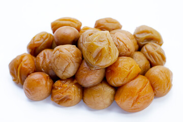 Pickled plums on white background.
