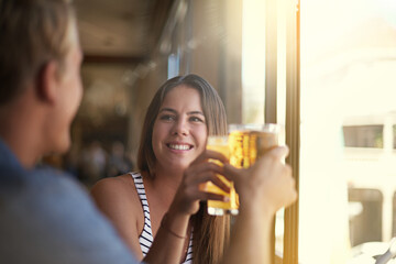 Toast, happy couple and drink beer in pub at party for celebration, relax and leisure together in restaurant. Smile, man and woman cheers with alcohol, beverage or glass at bar on a date at club