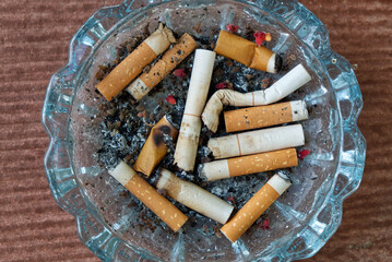 A Large Quantity of Cigarette Butts in the Ashtray on the Dining table.