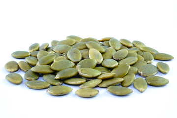 Heap of green pumpkin seeds concept background