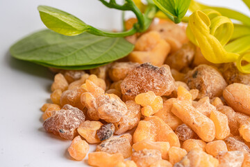 Frankincense or olibanum aromatic resin isolated on white background used in incense and perfumes.