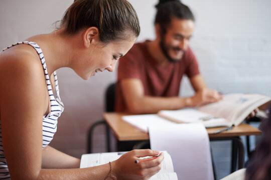 Woman, exam and writing in college, learning and knowledge on campus for education. Student, female person and notes for information in book, planning and research for studying or revision in profile