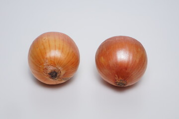 Ripe onions on a white background with room lighting