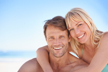 Portrait, love and happy couple hug at a beach with support, gratitude and bonding in nature...