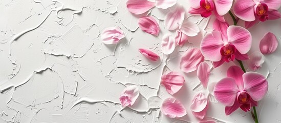 A painting depicting pink flowers, specifically a pink orchid in full bloom, against a white background. The vivid pink orchid petals stand out beautifully against the clean white canvas.
