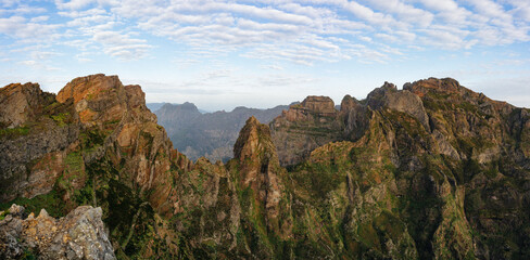 Fototapeta na wymiar Panoramic view of the mountains adjacent to Pico do Areeiro on a blue sky day on the island of Madeira